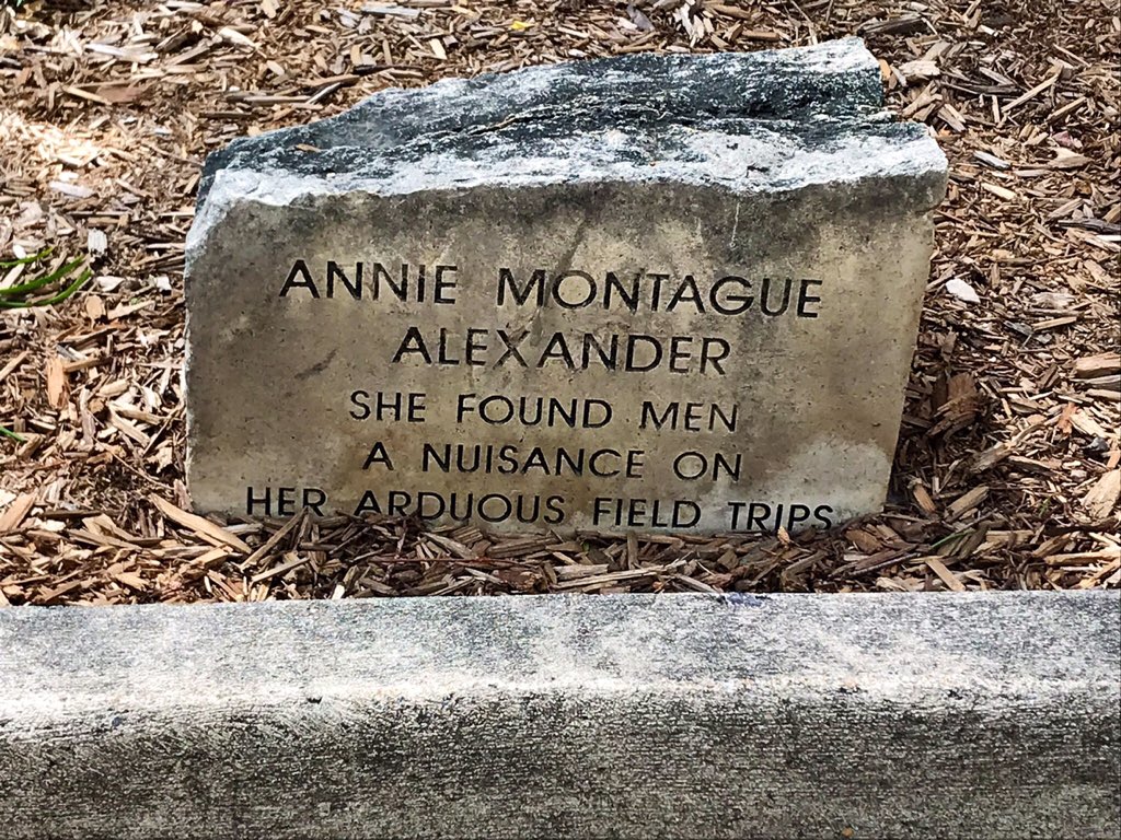 A stone with words "Annie Alexander, she found men a nuisance on her arduous field trips"