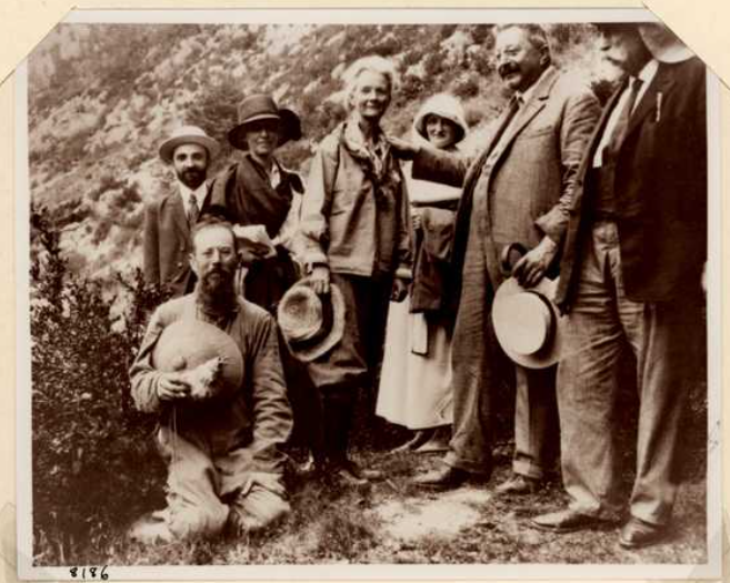 Annie Alexander with a gropu of men and women in the field